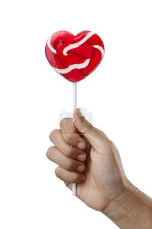 Hand holding lollipop in Heart Shape, Valentines Day Candy Lollypop isolated on white background