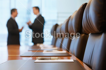Businessmen talking in conference room