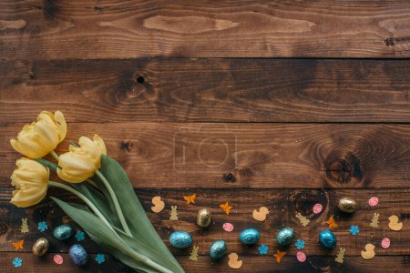 Easter holliday background with tulips on a wooden board, Place for text