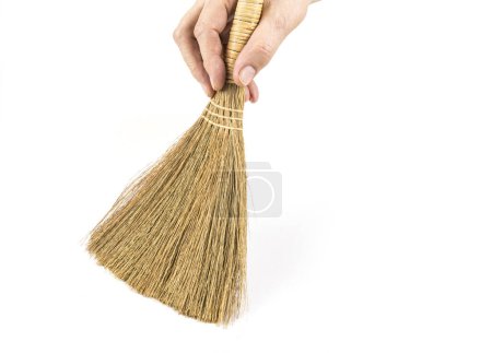 Small hand broom for household cleaning on the white