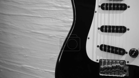 electric guitar closeup . White wall background with copy space