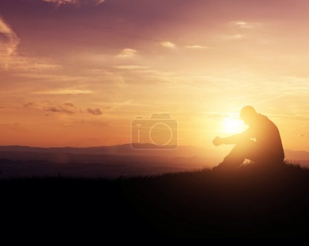 Praying at sunrise