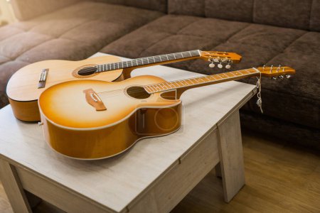two beautiful wooden acoustic guitars