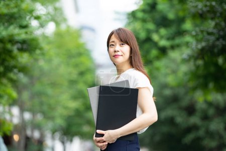 Outdoor portrait of Asian businesswoman