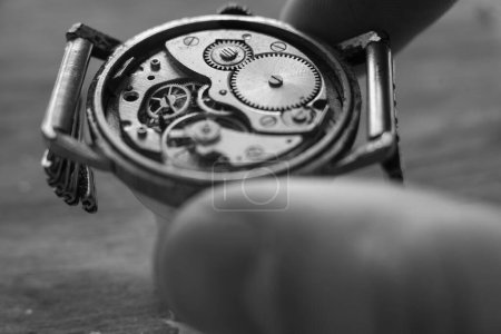 Watchmaker is repairing the wristwatch, mechanical watch