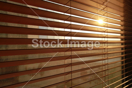 Sunlight behind vertical blinds