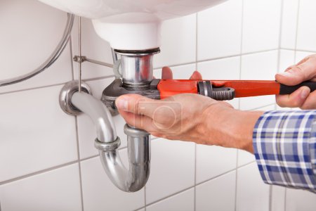 Plumber Fitting Sink Pipe