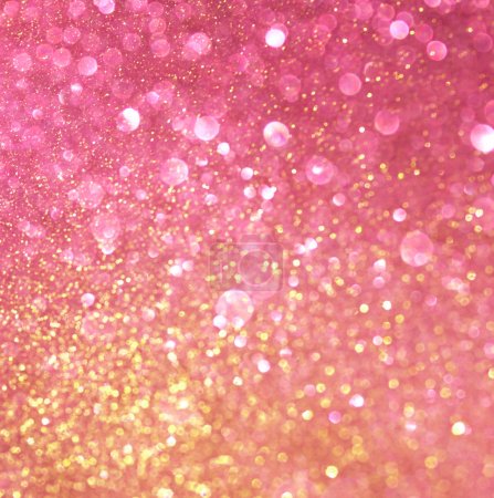 Gold and pink abstract bokeh lights. defocused background