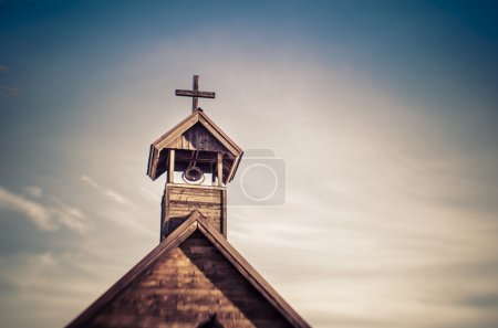 Rural old fashioned church steeple with bell
