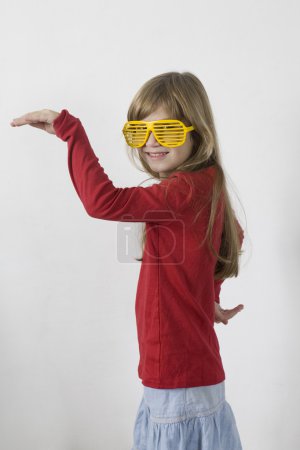 Girl in yellow sun glasses