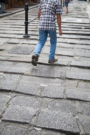 Man walking the rocky steps