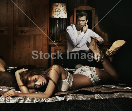 Two adult in bedroom posing