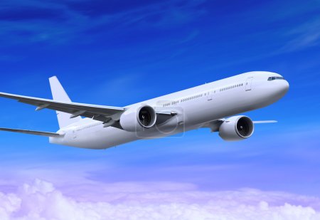 White passenger plane is landing away in the blue sky
