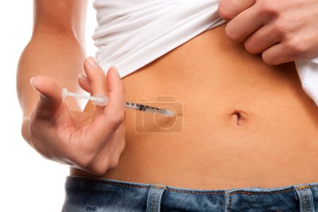Insulin dependent Diabetes patient make a subcutaneous injection by single use syringe with needle and Rapid-acting humalog insulin into abdomen by doctor pres