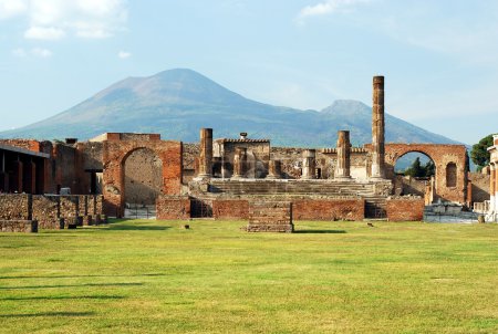 View of the Pompeii ruins in italy with Mount Vesuvius in background.