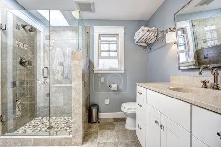Modern bathroom interior with glass door shower