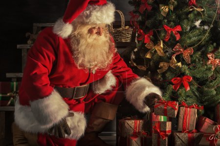 Santa is placing gift boxes