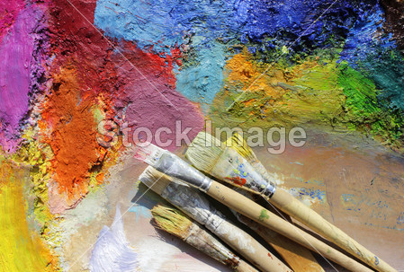 Oil paints palette and paint brushes