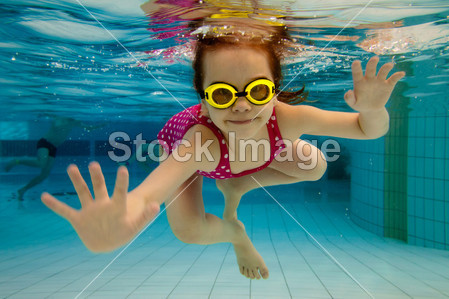 little girl swimming in water park