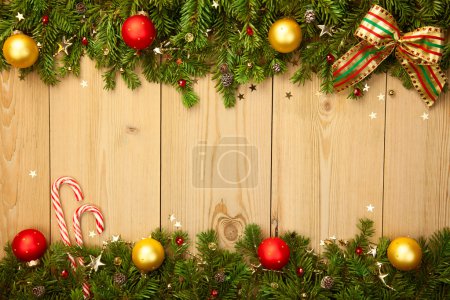Christmas background with firtree, candies and baubles 