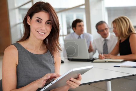 Executive woman working on electronic tab