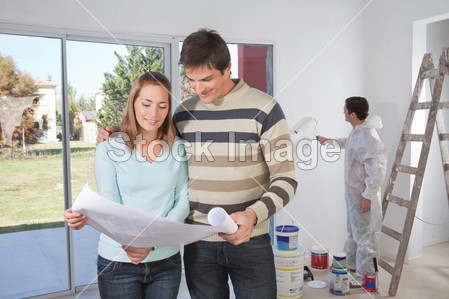 Couple going through house plan