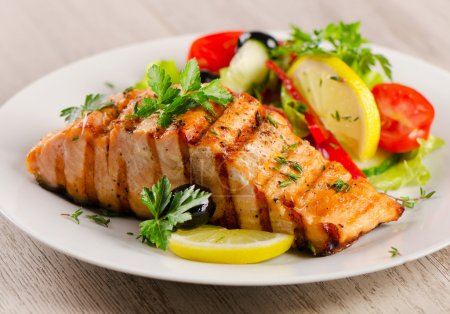 Grilled Salmon with  salad .