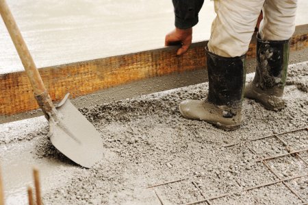 Man leveling concrete slab