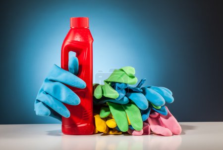Colorful cleaning equipment and blue background