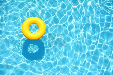 Yellow pool floats in a swimming pool