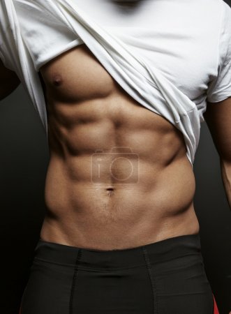 Athletic guy with perfect abs