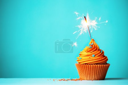 Orange cupcake with sparkler
