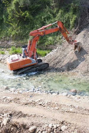 Excavator in the river