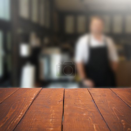 Empty table and blurred people in cafe background, product displ