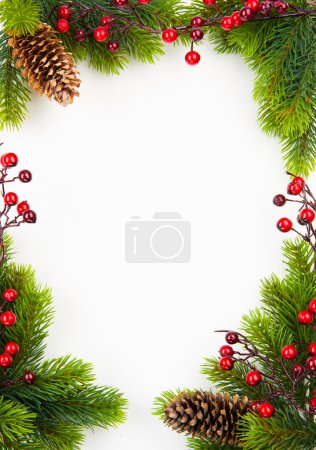 Christmas frame with fir and Holly berry on old paper background