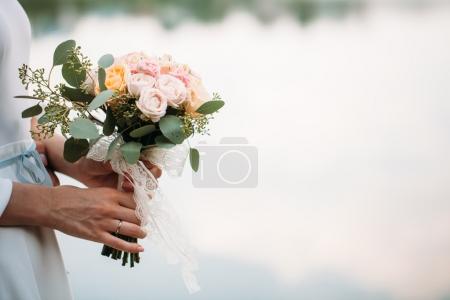 wedding bouquet of flowers in hands