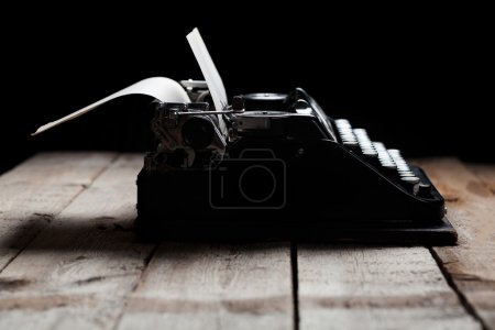 old typewriter on a wooden table
