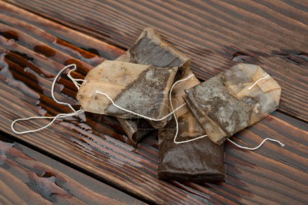 used teabags on a wooden background