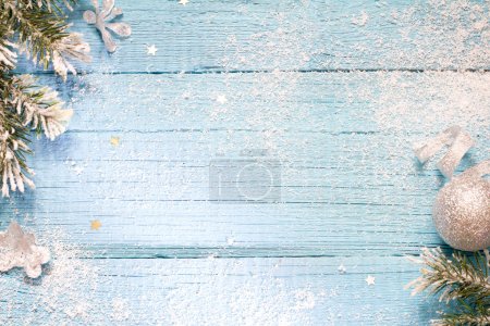 Snow and fir abstract christmas blue wooden background