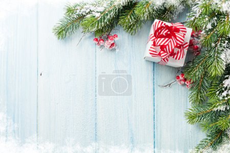 Christmas gift box and fir tree