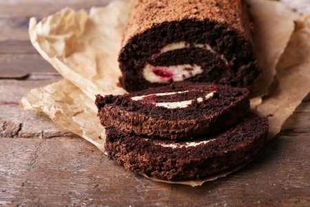 Chocolate roll with cream and berries