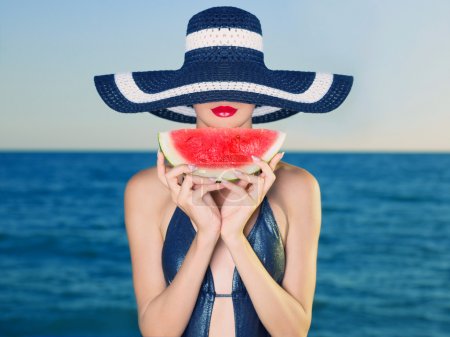 Young lady at sea with watermelon